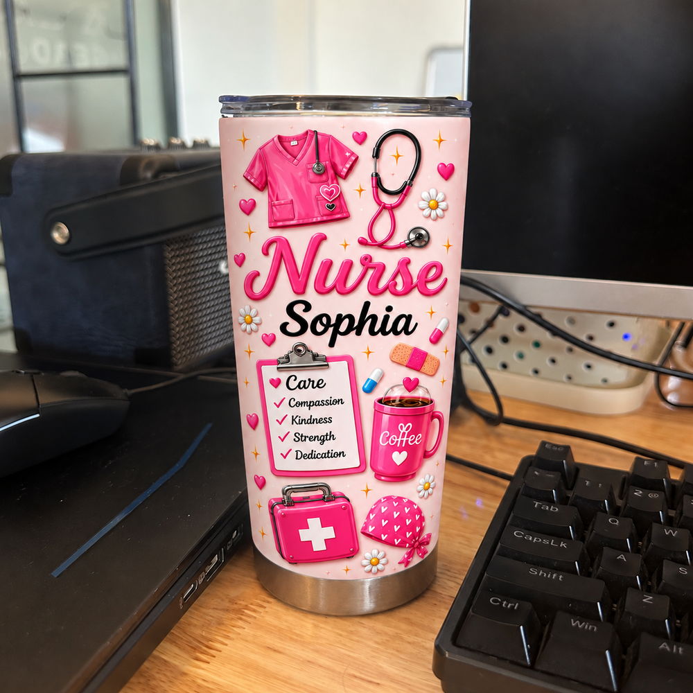 Custom pink nurse tumbler featuring scrubs, stethoscope, and 'Nurse Sophia' text on a desk near a computer keyboard.