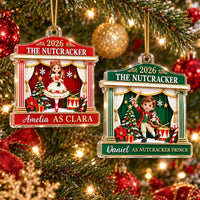 Two 2026 The Nutcracker Personalized Acrylic Christmas Ornaments hanging on a tree, one red with Clara and one green with the