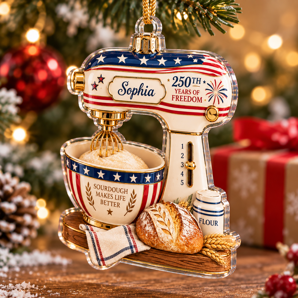 Patriotic christmas ornament featuring a Sourdough Makes Life Better kitchen mixer design hanging against a warm glowing
