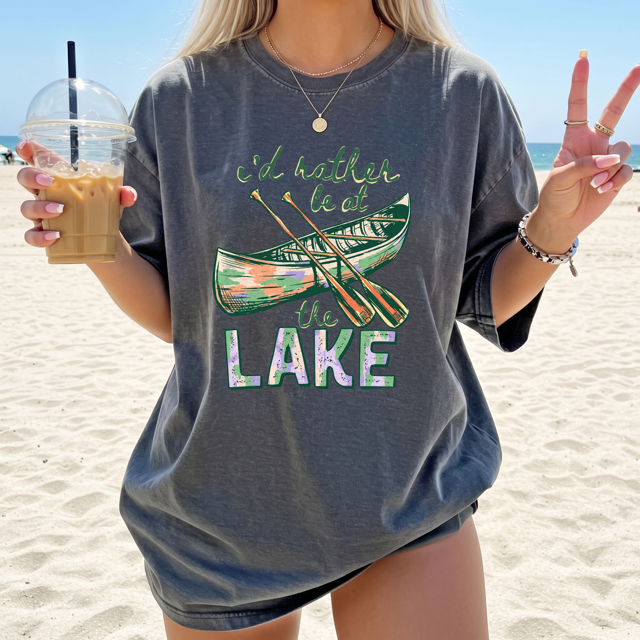 I'd Rather Be At The Lake Shirt Graphic T-Shirt For Lake Day Girl Trip Preppy Lakecore Granola Girl Oversized Fit Crew Neck With Green Purple Canoe Illustration Typography Print Retro Summer Vacation Boating Tee.