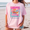 Sardines With Lemon And Olive Oil Graphic T-Shirt Oversized Graphic Tee For European Summer Quirky Coastal Preppy Aesthetic Mediterranean Vibes Light Yellow Cotton Blend Pink Blue Print Vintage Tinned Fish Fashion Beach Cover Up Retro Food Shirt