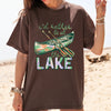 I'd Rather Be At The Lake Shirt Graphic T-Shirt For Lake Day Girl Trip Preppy Lakecore Granola Girl Oversized Fit Crew Neck With Green Purple Canoe Illustration Typography Print Retro Summer Vacation Boating Tee.