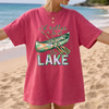 I'd Rather Be At The Lake Shirt Graphic T-Shirt For Lake Day Girl Trip Preppy Lakecore Granola Girl Oversized Fit Crew Neck With Green Purple Canoe Illustration Typography Print Retro Summer Vacation Boating Tee.