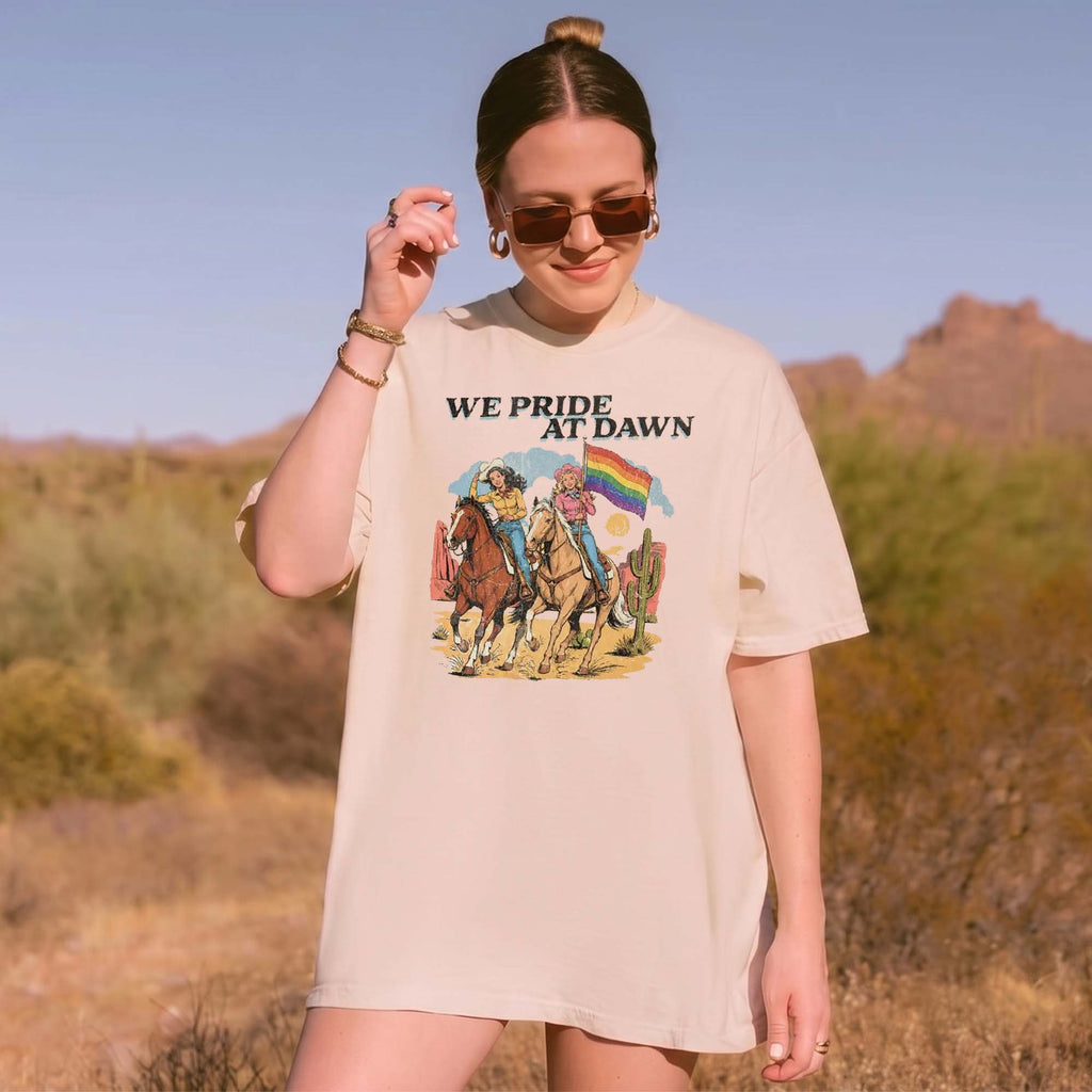 BojjiCo We Pride At Dawn T-Shirt Vintage Western Cowgirl Horse Riding Graphic Tee LGBTQ Rainbow Flag Pride Month Desert Cactus Cream Ivory TShirt Retro Southern Country Gay Lesbian Ally Gift Women Men Casual Aesthetic Short Sleeve Top