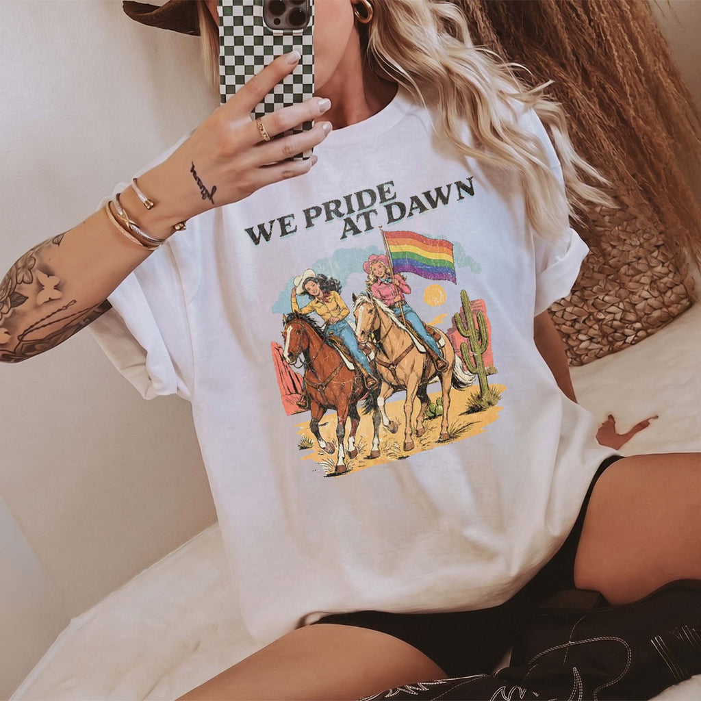 BojjiCo We Pride At Dawn T-Shirt Vintage Western Cowgirl Horse Riding Graphic Tee LGBTQ Rainbow Flag Pride Month Desert Cactus Cream Ivory TShirt Retro Southern Country Gay Lesbian Ally Gift Women Men Casual Aesthetic Short Sleeve Top