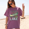 I'd Rather Be At The Lake Shirt Graphic T-Shirt For Lake Day Girl Trip Preppy Lakecore Granola Girl Oversized Fit Crew Neck With Green Purple Canoe Illustration Typography Print Retro Summer Vacation Boating Tee.