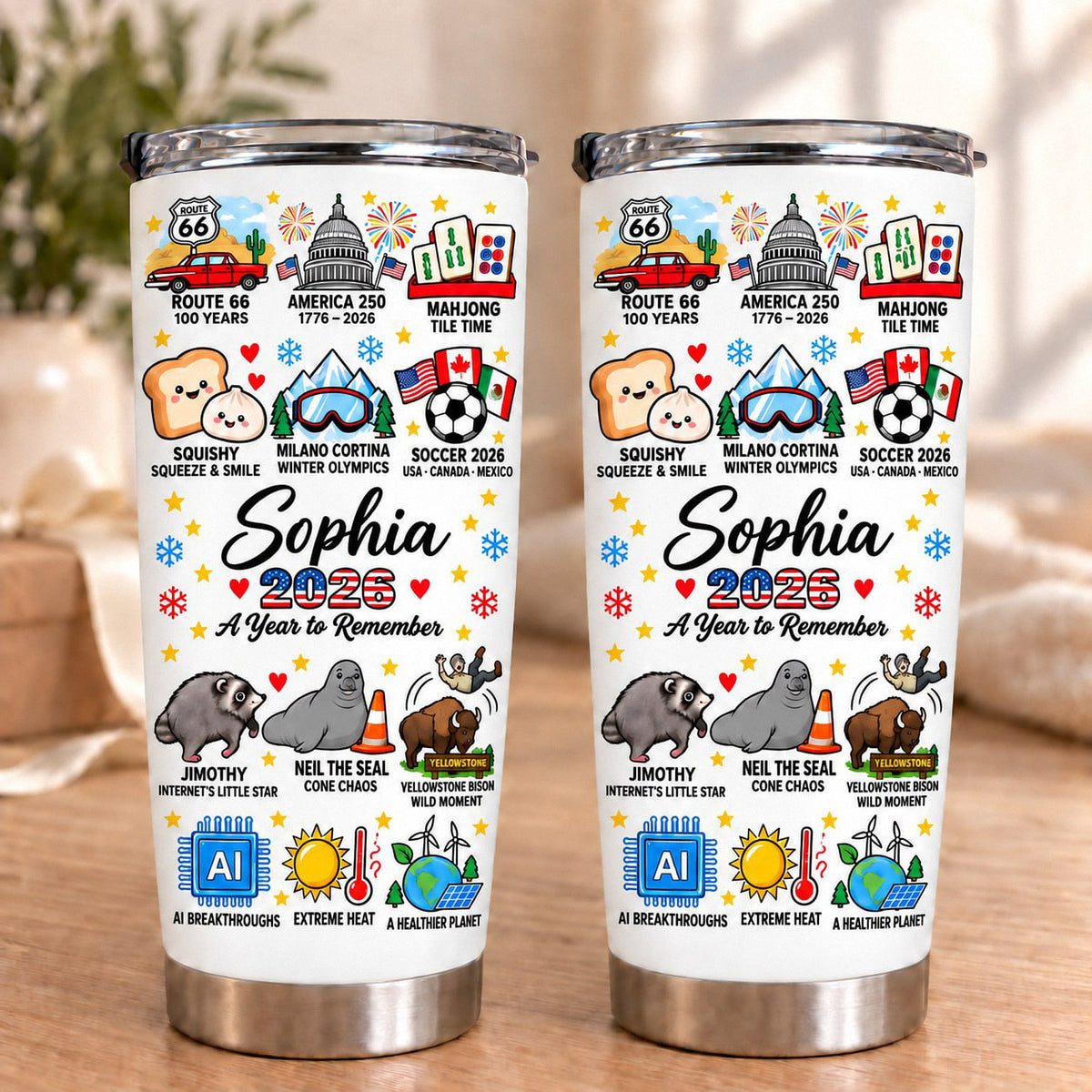 Two personalized insulated stainless steel tumblers showing 2026 milestone designs.