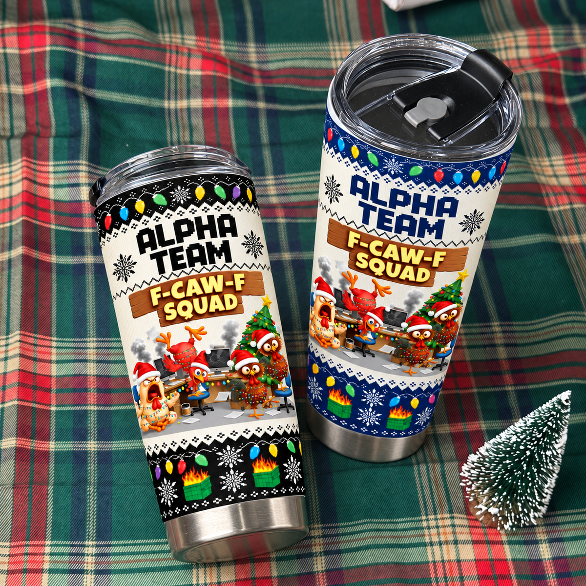 Two stainless steel tumblers with office chicken meme design resting on a plaid fabric background.