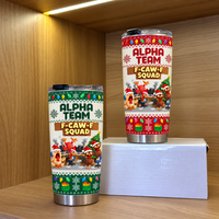 Red and white stainless steel tumblers with funny chicken design displayed on a shelf with a white box.