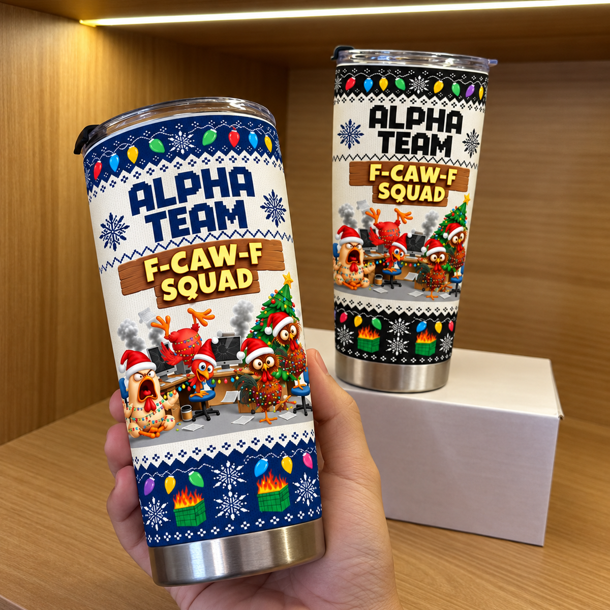 Hand holding stainless steel tumbler with funny chicken holiday print and white background on a wooden shelf.