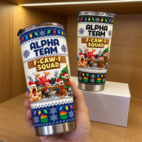 Hand holding stainless steel tumbler with funny chicken holiday print and white background on a wooden shelf.