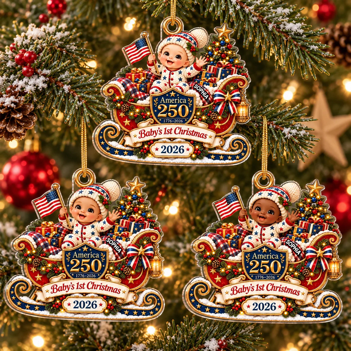 Three America 250 baby's first Christmas ornaments hanging on a glowing holiday tree with festive red and gold decorations.