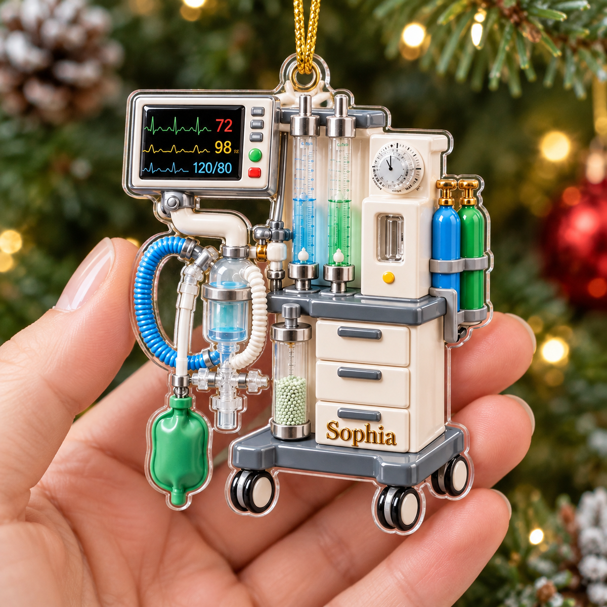 Anesthesia Machine Ornament Personalized Acrylic held in a hand before Christmas tree