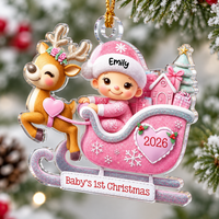 A pink acrylic Christmas ornament features a custom name and year on a snowy tree background.