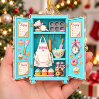 Person holding the flat acrylic baking ornament to demonstrate its scale and glossy finish against a Christmas tree.