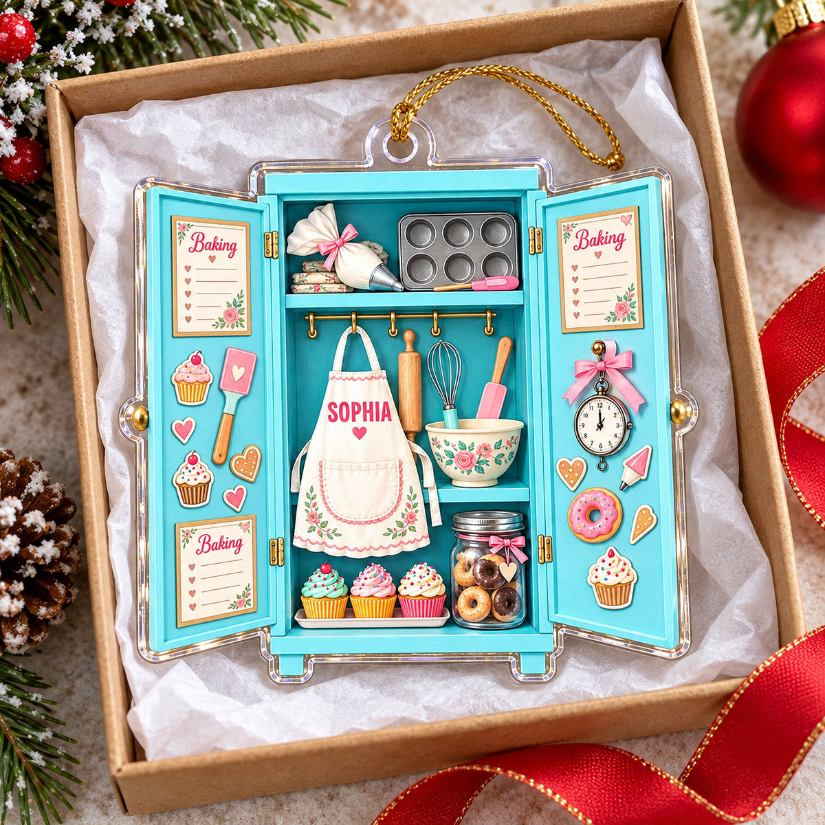 Turquoise baking ornament with open doors in a gift box, featuring a custom apron, cupcakes, and baking tools.