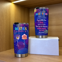 Two custom name insulated tumblers on a wooden shelf, one held in hand and one on top of a white box
