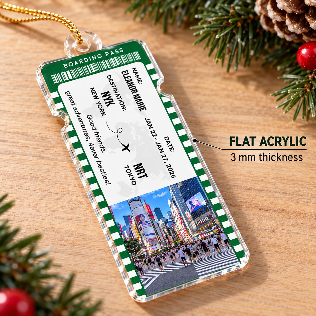 Close-up of a green bordered boarding pass ornament displaying Tokyo graphics and flat acrylic thickness.