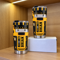 Two drill theme stainless steel insulated cups in yellow and black with name BRIAN displayed on and beside a white box.