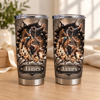 Two stainless steel cowboy tumblers featuring a customized nameplate and dynamic bull rider graphics on a wooden tabletop.