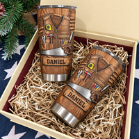 Two Personalized Carpenter Tool Belt Tumblers presented inside a gift box filled with paper shred.