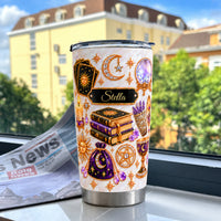 Personalized Celestial Witch Tumbler with tarot cards and books on a windowsill.