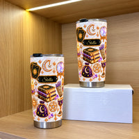 Two personalized celestial witch tumblers standing on a wooden shelf.