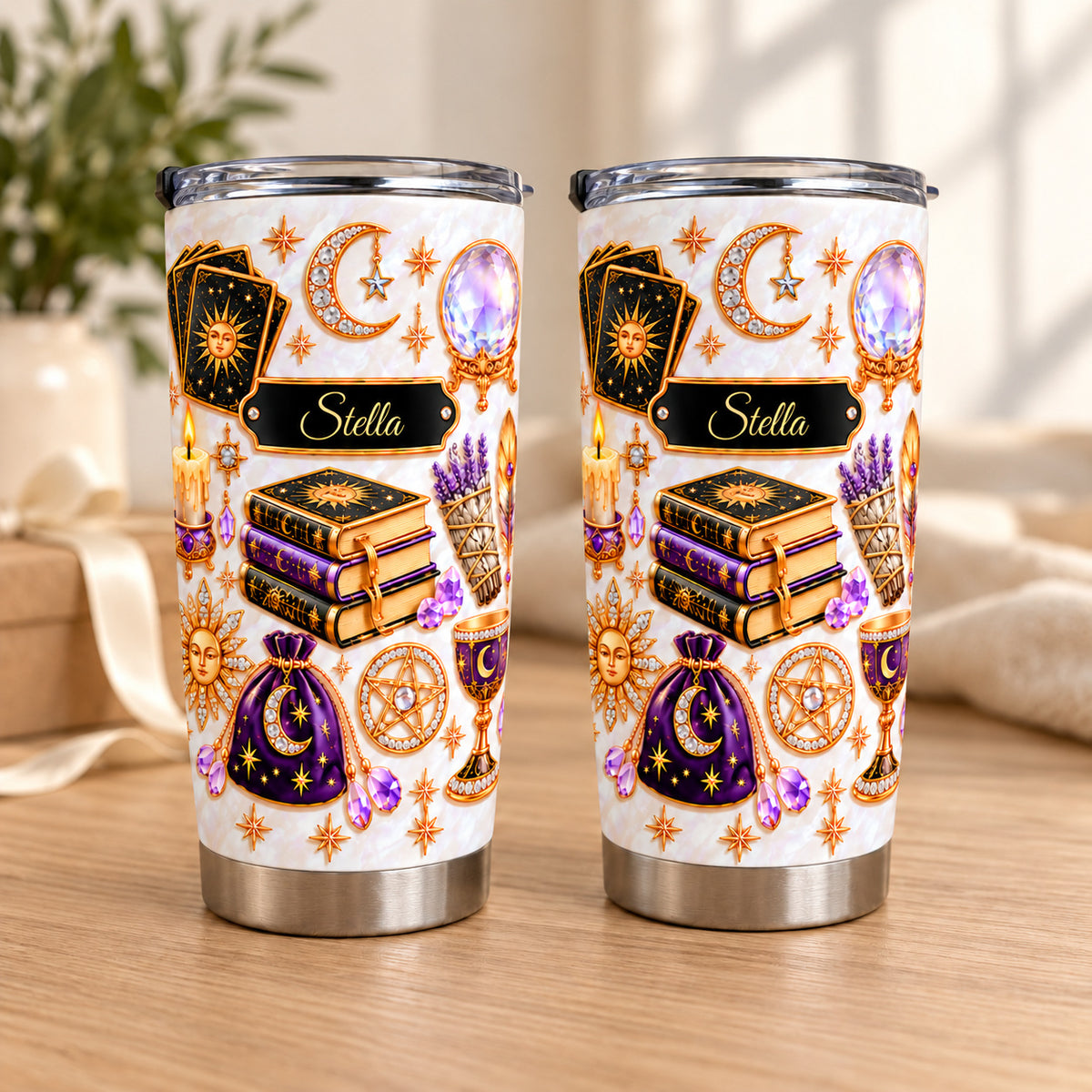 Two personalized celestial witch tumblers standing side by side on a table.