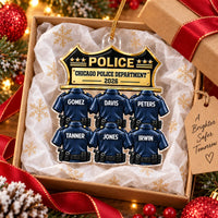 A custom Chicago Police Department ornament inside an open gift box lined with tissue paper.