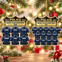 Two personalized Chicago Police Department ornaments hanging side by side on a twinkling Christmas tree.
