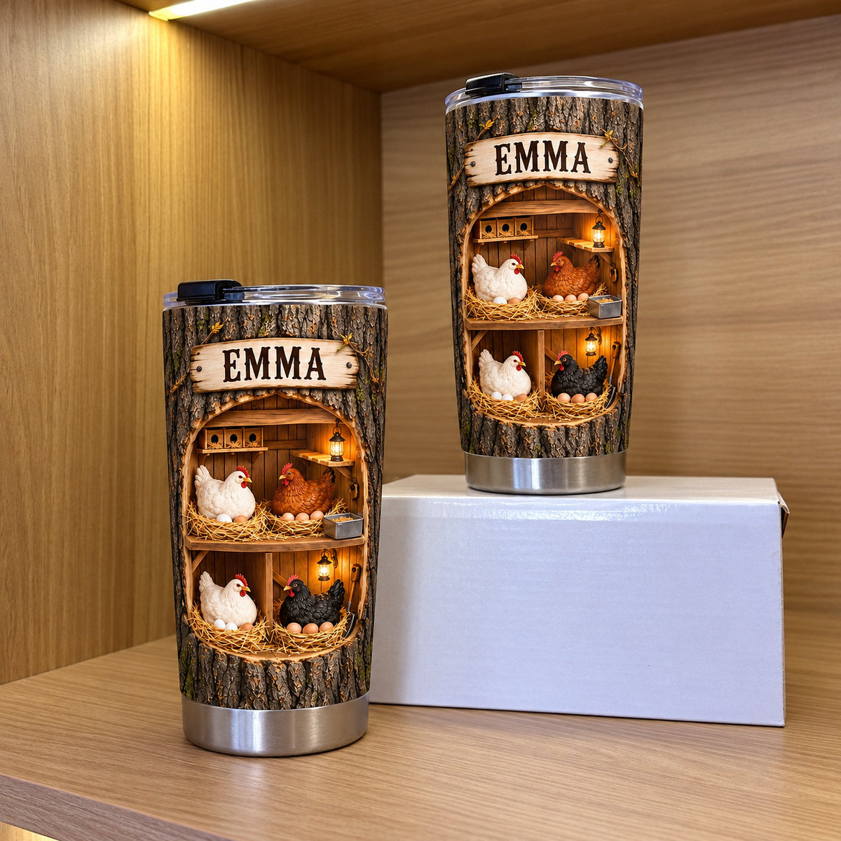 Two stainless steel tumblers with chicken coop graphic and wooden nameplate standing on a shelf.