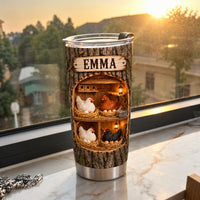 Chicken coop tumbler personalized design sitting on a windowsill during sunset with warm glow.