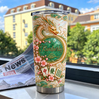 Chinese Dragon Mahjong Jade Tumbler standing near a window with a newspaper and outdoor background.