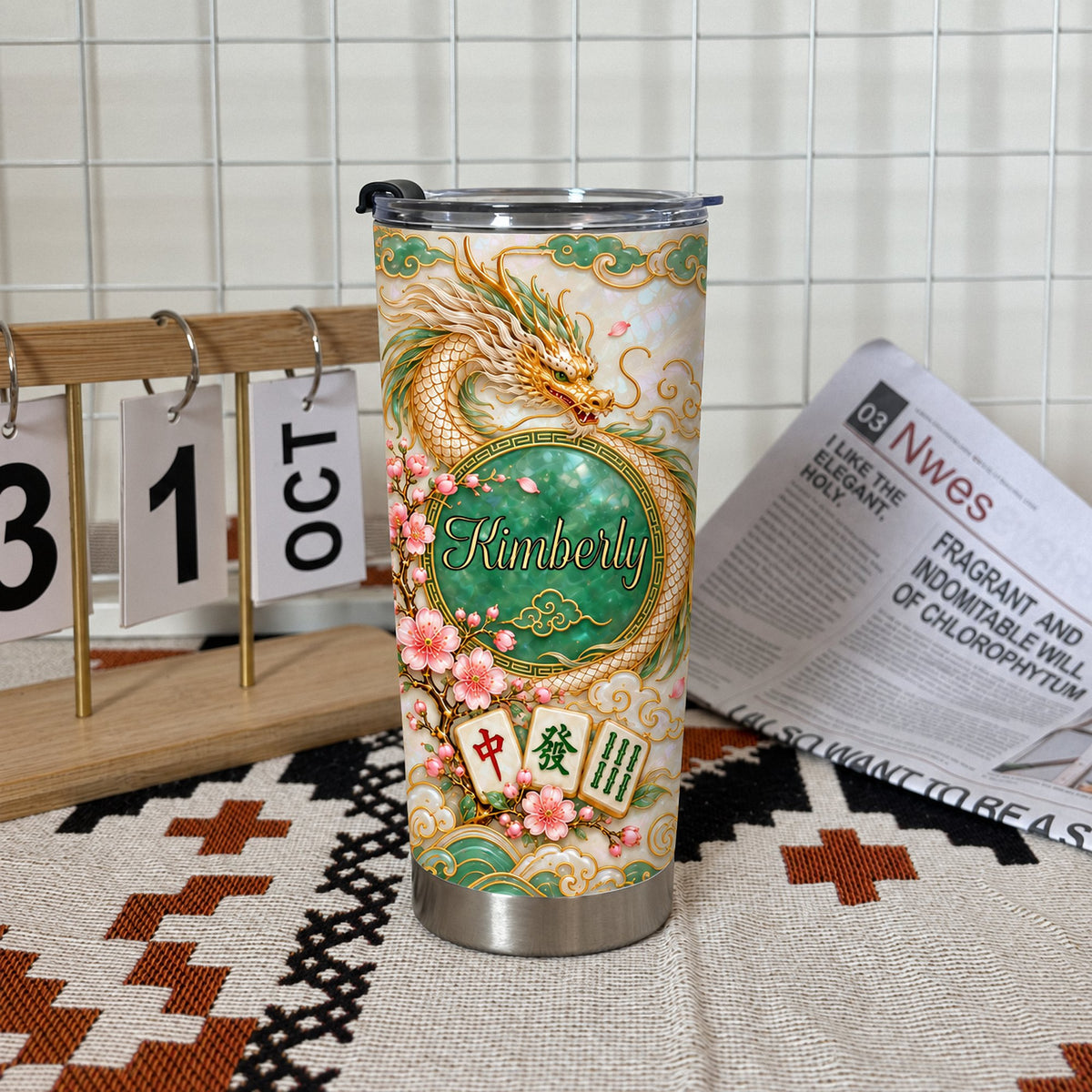 Chinese Dragon Mahjong Jade Tumbler with custom name Kimberly, gold dragon, pink cherry blossoms, and tiles on table.