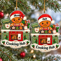 Two personalized Gingerbread Kitchen Christmas Gift ornaments hanging side by side.