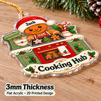 Clear acrylic baking theme ornament angled on a wooden surface with thickness details.