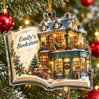 Close-up of the flat acrylic book ornament hanging on a festive Christmas tree.