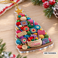 Personalized acrylic Christmas tree ornament showing a 3mm thickness and flat transparent design on a wooden surface.