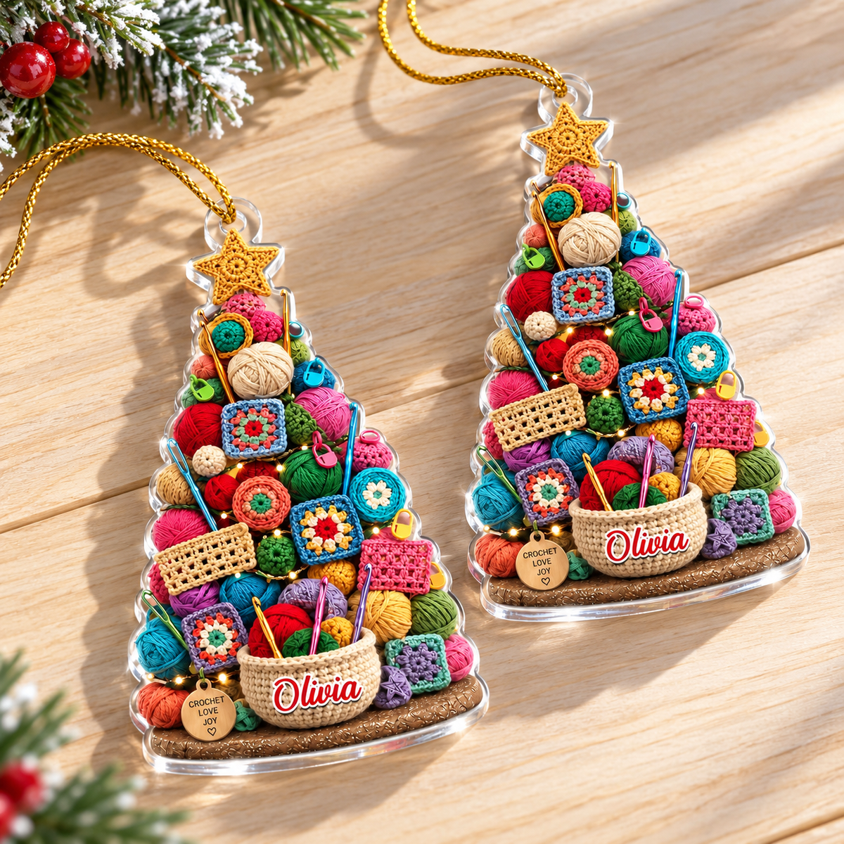 Two personalized acrylic Christmas tree ornaments shaped like a tree filled with colorful yarn art, displayed side by side.