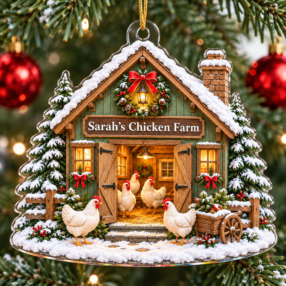 Custom acrylic chicken coop ornament hanging on a snowy Christmas tree with red baubles