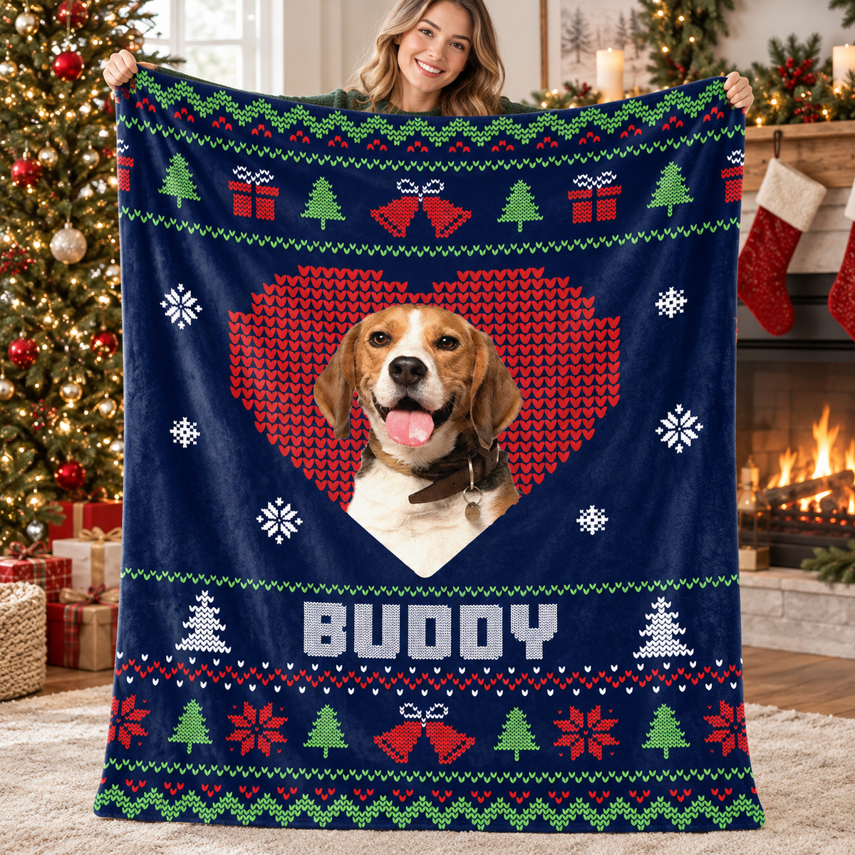 Smiling woman holding up a custom pet photo Christmas fleece blanket indoors.