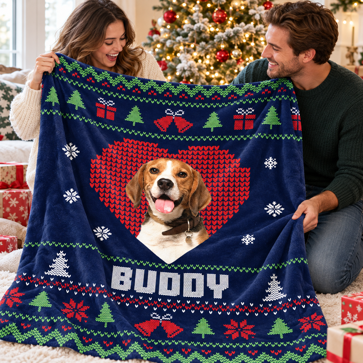 Couple holding a navy blue custom pet photo holiday blanket near a tree.