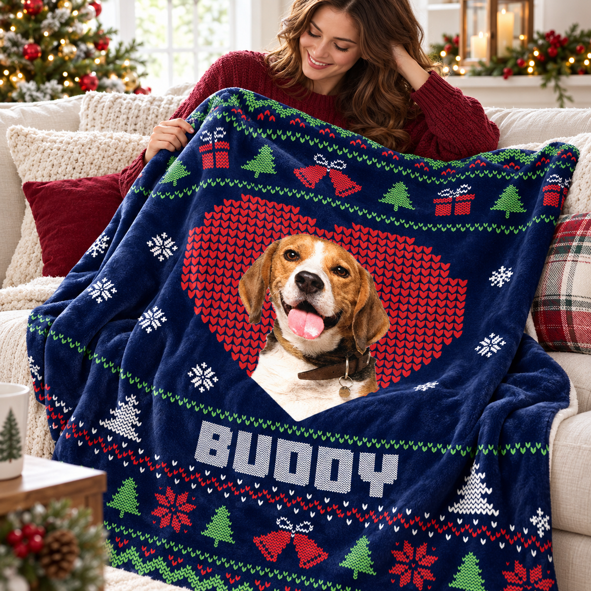 Woman holding a custom pet photo Christmas blanket with a beagle inside a red heart and the name Buddy on a navy blue ugly