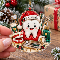 Person holding custom acrylic dentist Christmas ornament featuring cartoon tooth and dental tools