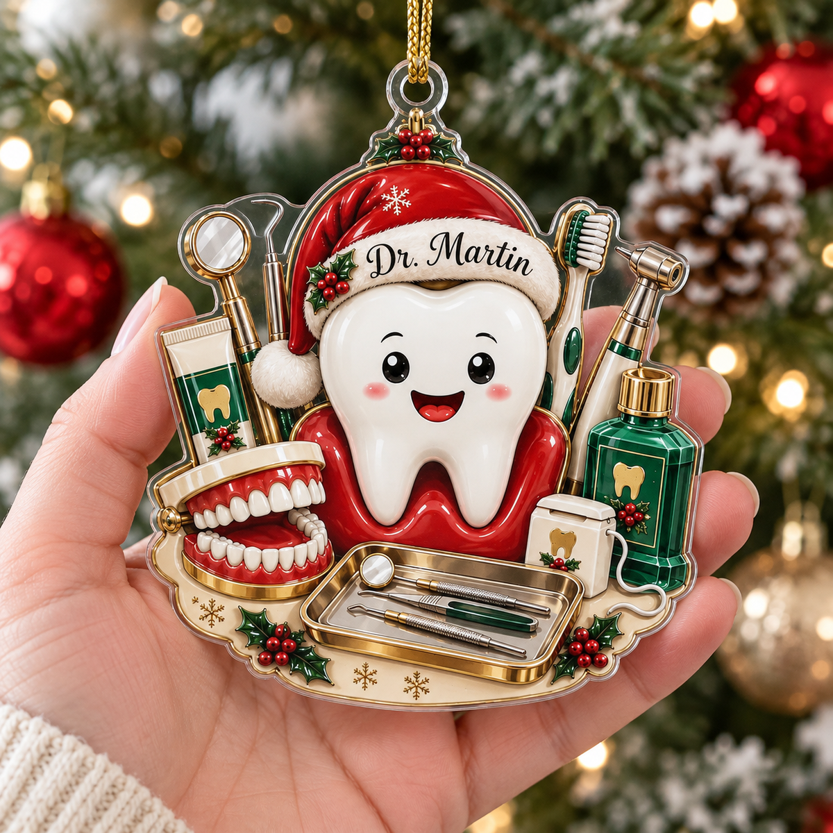Hand holding personalized dental hygienist gift ornament against blurred Christmas tree lights