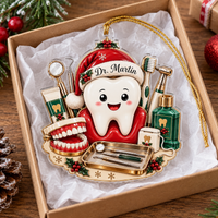 Personalized dentist Christmas ornament nestled inside open gift box with white tissue paper