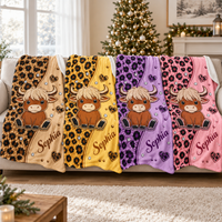 Four plush fleece blankets with highland cow and leopard print designs in brown, yellow, purple, and pink.
