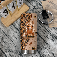 Personalized horse tumbler with cute pony and leopard print standing on rustic wooden surface beside calendar block and lid.