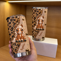 Hand holding personalized horse tumbler with cute pony and leopard print design on wooden shelf with another tumbler behind
