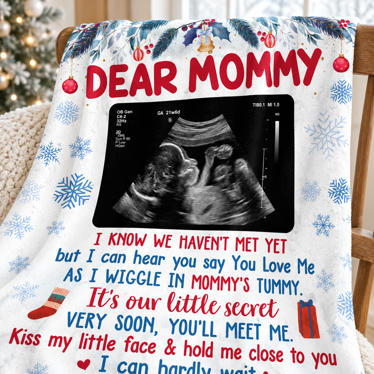 Close-up of the Dear Mommy flannel throw blanket showing the ultrasound frame and holiday border.